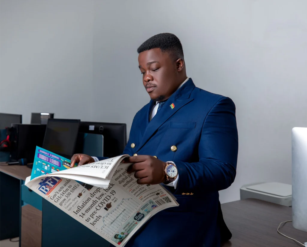 Corporate portrait of an executive reading a newspaper