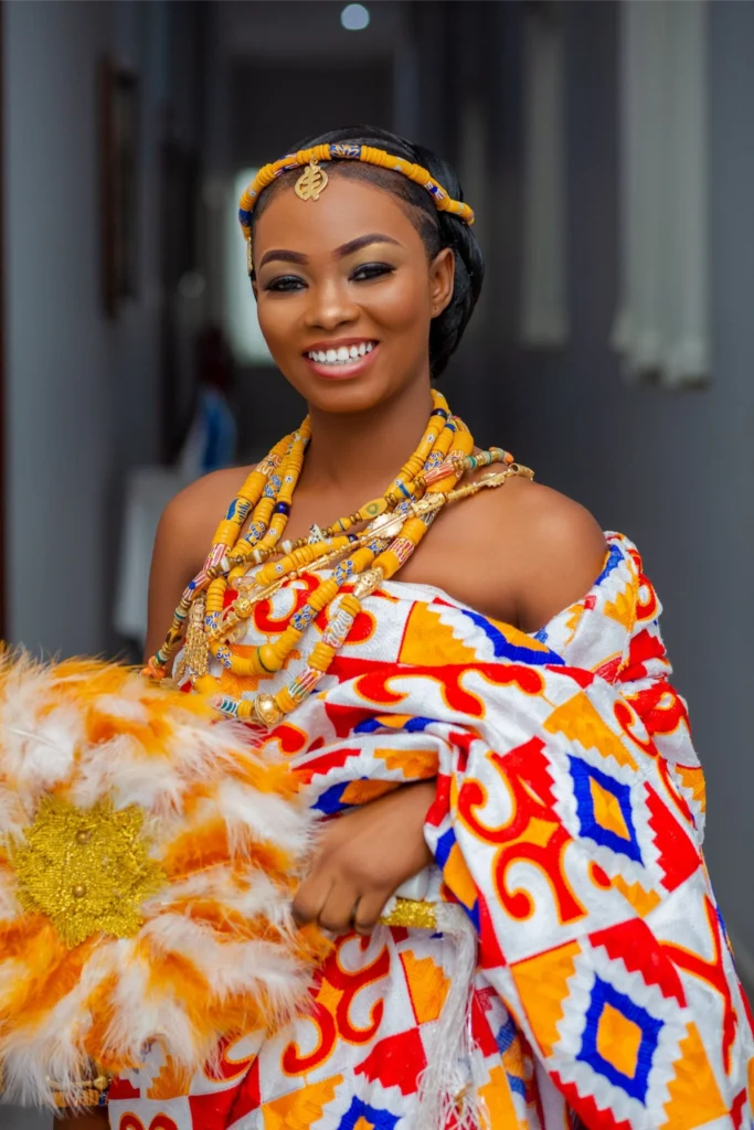 Bride in kente cloth photographed by VibMedia